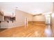 Living room with laminate floors adjoining a kitchen and dining area at 153 Pine Isle Dr, Sanford, FL 32773