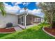 Screened patio with a lush backyard featuring manicured lawn at 153 Pine Isle Dr, Sanford, FL 32773