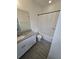 Bathroom with tile floors, a granite countertop, and a shower with tub at 16043 Scarpetta St, Winter Garden, FL 34787