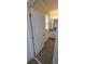 Bathroom with tile floors, a granite countertop, and a large window at 16043 Scarpetta St, Winter Garden, FL 34787