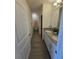 Bathroom featuring a double sink vanity with granite countertops and modern fixtures at 16043 Scarpetta St, Winter Garden, FL 34787