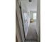 Bedroom doorway leading to carpeted floor, yellow chair, and natural light at 16043 Scarpetta St, Winter Garden, FL 34787