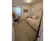Bright bedroom with a bed and a desk area, creating a versatile and inviting space at 16043 Scarpetta St, Winter Garden, FL 34787