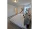 A comfortably furnished bedroom features carpeted floors and soft, natural lighting at 16043 Scarpetta St, Winter Garden, FL 34787