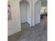 Foyer featuring arched doorways and tile flooring throughout at 16043 Scarpetta St, Winter Garden, FL 34787