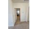 Hallway with a door open to a room with a desk and chair, with natural light from the window at 16043 Scarpetta St, Winter Garden, FL 34787