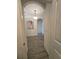 Hallway with tile flooring and decorative lighting at 16043 Scarpetta St, Winter Garden, FL 34787