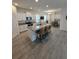 Spacious kitchen featuring an island with seating and stainless-steel appliances at 16043 Scarpetta St, Winter Garden, FL 34787