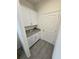 Laundry room with plenty of cabinet space, granite countertops, and tile floors at 16043 Scarpetta St, Winter Garden, FL 34787