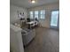 Bright room featuring a couch, desk, natural light and door to the outside at 16043 Scarpetta St, Winter Garden, FL 34787