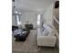 Cozy living room with neutral colors, plush seating, and natural light at 16043 Scarpetta St, Winter Garden, FL 34787