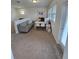 Cozy living room area with a comfortable couch, desk and many windows at 16043 Scarpetta St, Winter Garden, FL 34787