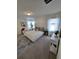 Inviting main bedroom with neutral tones, large windows, and stylish furnishings at 16043 Scarpetta St, Winter Garden, FL 34787