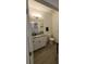 A well-lit powder room with granite counters and modern fixtures at 16043 Scarpetta St, Winter Garden, FL 34787