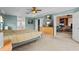 Spacious bedroom featuring a ceiling fan, a walk-in closet, and an ensuite bath at 2005 Pitch Way, Kissimmee, FL 34746