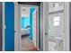 Hallway showing bedroom, bathroom, and blue painted wall at 2005 Pitch Way, Kissimmee, FL 34746