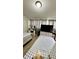 Cozy bedroom with modern decor and entertainment setup at 2350 Valley Dr, Apopka, FL 32703