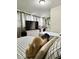 Comfortable bedroom with twin beds, TV, and decorative touches at 2350 Valley Dr, Apopka, FL 32703