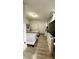 Spacious bedroom with twin beds, closets, and entertainment center at 2350 Valley Dr, Apopka, FL 32703