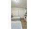 Bright bedroom featuring two beds and ample closet space at 2350 Valley Dr, Apopka, FL 32703