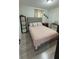 Cozy bedroom with queen bed, bedside tables and natural light from the window at 2350 Valley Dr, Apopka, FL 32703