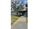 Charming single-story home with a covered front porch and mature landscaping at 2350 Valley Dr, Apopka, FL 32703