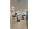 Modern kitchen featuring stainless steel appliances, bright white cabinetry, and tile floors at 2350 Valley Dr, Apopka, FL 32703