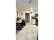 View of home office featuring desk, chair, shelving and access to other rooms at 2350 Valley Dr, Apopka, FL 32703
