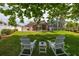 Expansive backyard with mature trees, lush lawn and a screen enclosed lanai at 239 King George Dr, Davenport, FL 33837