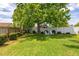 Spacious backyard featuring a large tree offering plenty of shade for outdoor relaxation at 239 King George Dr, Davenport, FL 33837