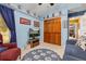 Blue bedroom with decorative shelving and a closet. Small sofa for relaxing at 239 King George Dr, Davenport, FL 33837