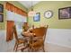 Cozy breakfast nook with wooden table, chairs, and natural light at 239 King George Dr, Davenport, FL 33837