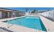 Community pool with clear blue water and fenced in for safety and privacy at 239 King George Dr, Davenport, FL 33837