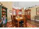 Dining room features a wooden table with seating for six and views of decor and the entranceway at 239 King George Dr, Davenport, FL 33837