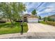 Inviting single-Gathering home with a manicured front yard and a large two-car garage at 239 King George Dr, Davenport, FL 33837