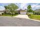 Charming single-story home with well-manicured lawn and two-car garage at 239 King George Dr, Davenport, FL 33837