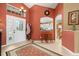Inviting foyer with decorative rug and view into the kitchen and breakfast nook at 239 King George Dr, Davenport, FL 33837