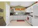 Bright kitchen with white cabinets, modern appliances, and tiled backsplash at 239 King George Dr, Davenport, FL 33837
