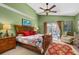 Cozy main bedroom with a ceiling fan and a sliding door leading to the backyard at 239 King George Dr, Davenport, FL 33837