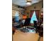 Home office featuring a work space, shelving and space for two rolling office chairs at 239 King George Dr, Davenport, FL 33837