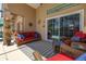 Relaxing covered patio complete with ample seating and sliding glass doors leading to the pool area at 239 King George Dr, Davenport, FL 33837