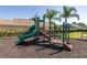 Community playground area features a slide and climbing structure, perfect for active recreation at 239 King George Dr, Davenport, FL 33837