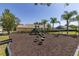 Community playground features slides, steps, and more for fun outdoor activity at 239 King George Dr, Davenport, FL 33837