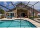 Beautiful pool with screened enclosure, inviting lounge areas, and an immaculate backyard space at 239 King George Dr, Davenport, FL 33837