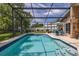 Inviting screened-in pool with a covered patio, ideal for outdoor relaxation and leisure at 239 King George Dr, Davenport, FL 33837