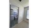 Bathroom view from a bedroom featuring a shower and updated vanity at 2451 Quail Run N Blvd, Kissimmee, FL 34744