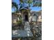 Inviting single-story home with a pathway leading to the front entrance and arched windows at 2451 Quail Run N Blvd, Kissimmee, FL 34744