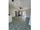Spacious living room with tile flooring, ceiling fan, and a large window at 2451 Quail Run N Blvd, Kissimmee, FL 34744