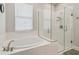Modern bathroom features a soaking tub and separate glass-enclosed shower for a luxurious experience at 249 Bella Cortina Dr, Kissimmee, FL 34759