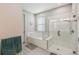 Modern bathroom features a soaking tub and separate glass-enclosed shower for a luxurious experience at 249 Bella Cortina Dr, Kissimmee, FL 34759